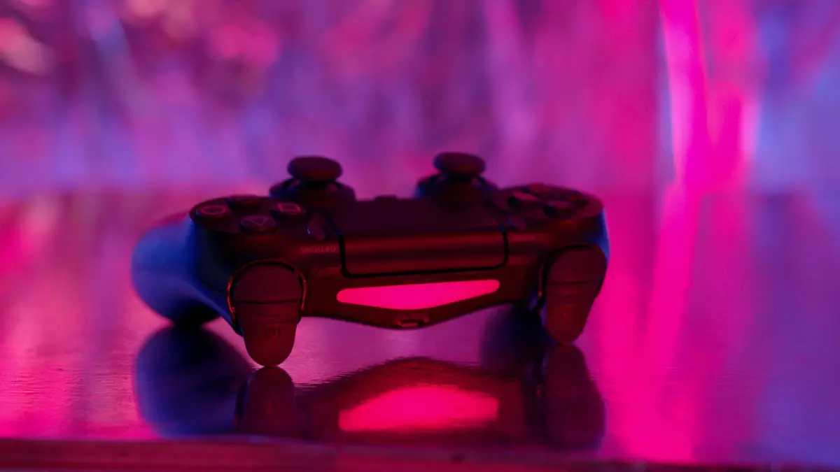 A game controller lit by neon